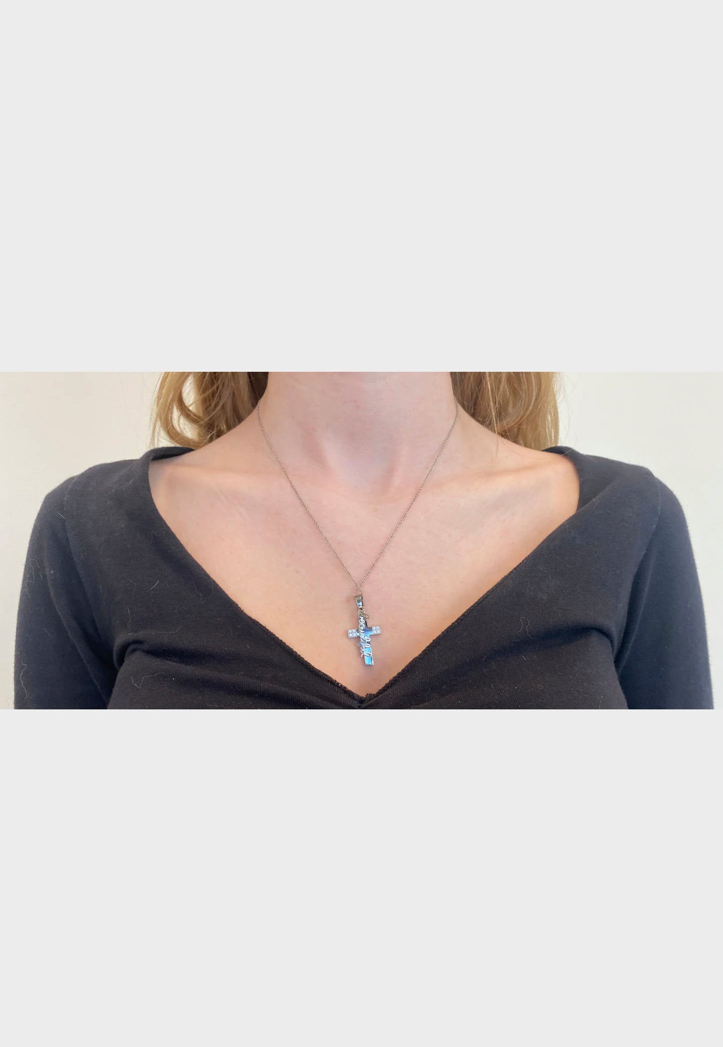 Be Still Christian necklace worn by female model