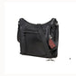 Pistol shown in conceal carry compartment of leather gun purse