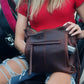 model with conceal carry purse demonstrating use