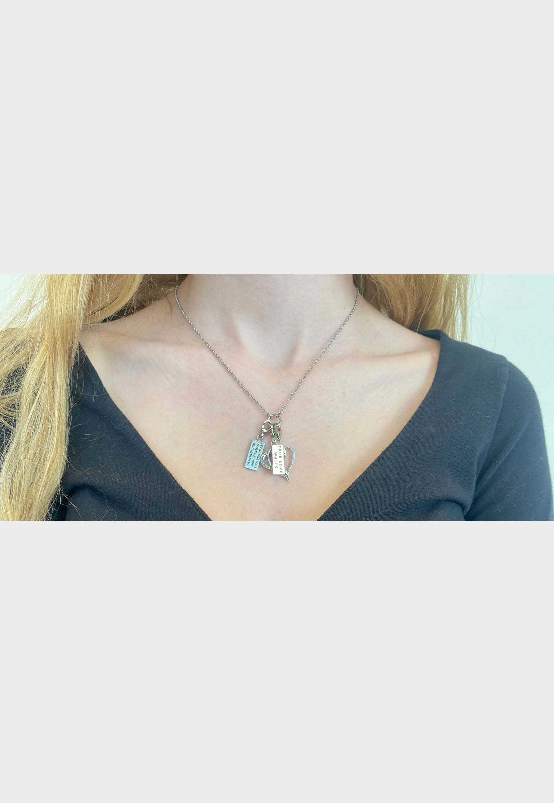 Woman wearing Christian charm necklace