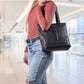 model wearing leather gun purse over shoulder