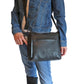 Model demonstrating leather crossbody conceal carry bag with pistol