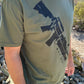 Model wearing and AR15 t-shirt with gun on sling