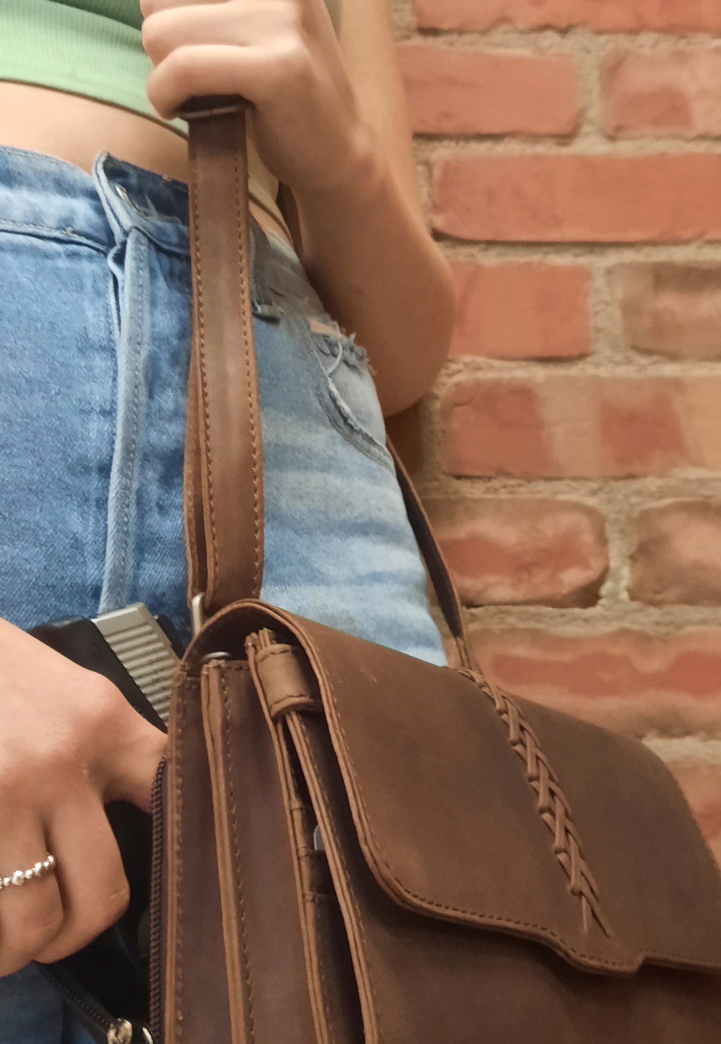 model with gun bag on shoulder