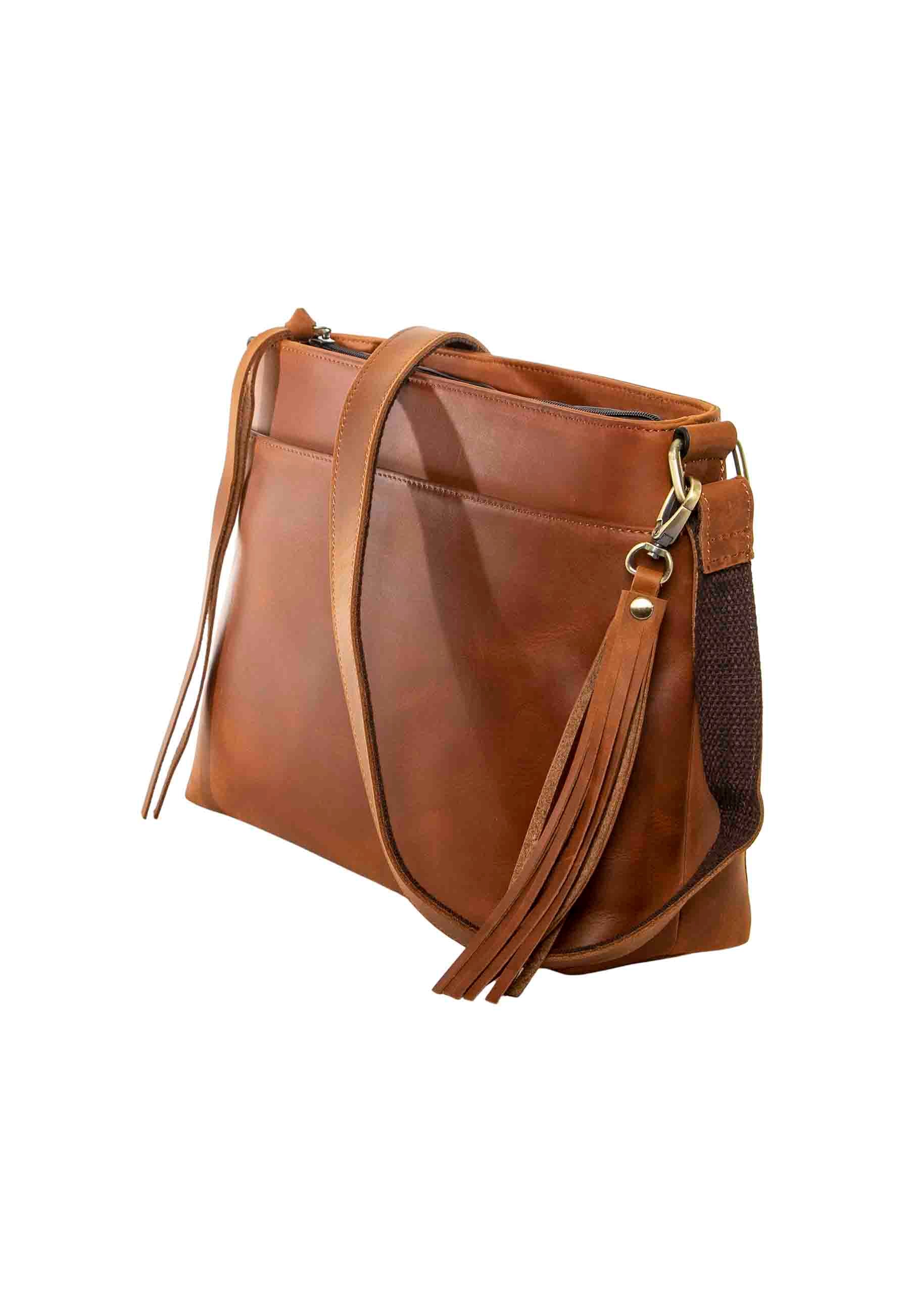 angle view of pistol purse in brown leather