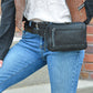 Model with leather concealed carry pack on her hip