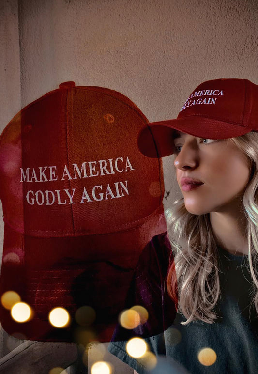 model wearing make america godly again hat