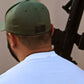 Rear view of ArmedAF® logo hat on model showing American flag