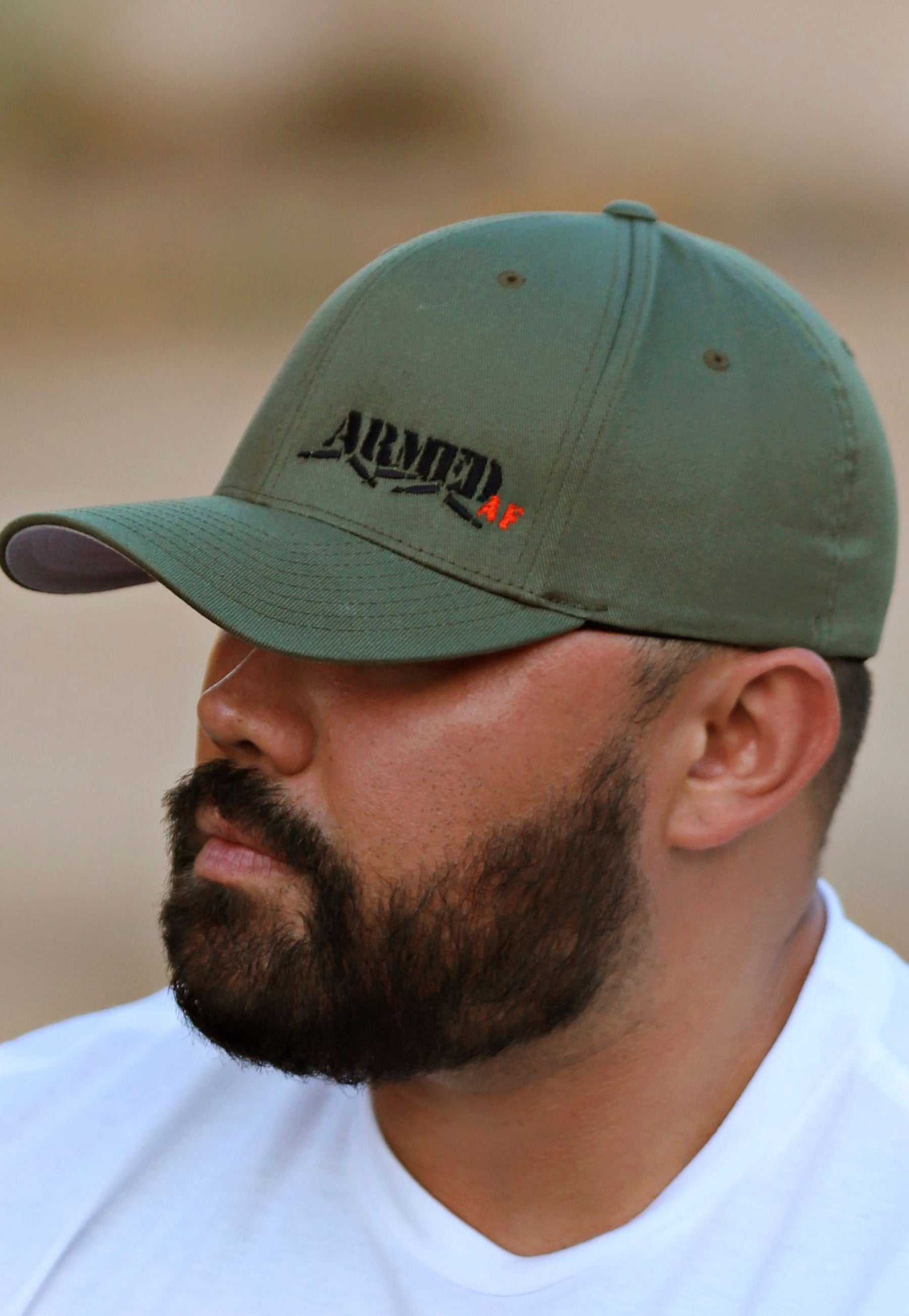 Model wearing ArmedAF® logo hat in army green